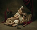 Modern remake of classical artwork with modern tech theme - young medieval couple on dark background Royalty Free Stock Photo