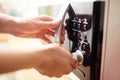 Using microwave oven, close up photo Royalty Free Stock Photo