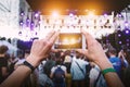 Using a mobile phone at outdoor music festival Royalty Free Stock Photo