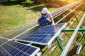 Using modern equipment, mounter installing solar panels on the roof.