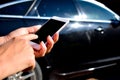 Using the phone in the car. New technologies and car. Royalty Free Stock Photo