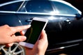 Using the phone in the car. New technologies and car. Royalty Free Stock Photo