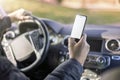 Texting and looking at screen while driving using mobile cell phone in car Royalty Free Stock Photo