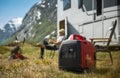 Using Portable Gasoline Inverted Generator While Dry Camping Royalty Free Stock Photo