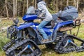 Using quad bike to transport tree trunks