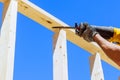 Using reciprocating saw to cut wood beams is a construction theme that uses power tools Royalty Free Stock Photo