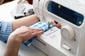 Using a sewing machine in tailor workshop Royalty Free Stock Photo