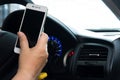 Using smart phone while car driving.safety car concept Royalty Free Stock Photo