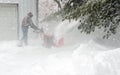 Using a snow blower to clear snow Royalty Free Stock Photo