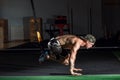 Using TRX bands, doing push-ups and torso rotations with legs suspended.