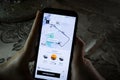 Using the Uber app on a smartphone - City maps and transportation