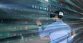 Using virtual reality headset, person interacting with cybercrime data and numbers