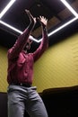 Using VR headset, man in business attire interacting with virtual environment