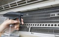 Using water spray on air conditioner