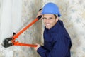 using wire stripper tool with wall Royalty Free Stock Photo