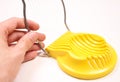 Using yellow egg slicer cutter isolated Royalty Free Stock Photo