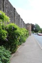 USK PRISON STONE WALL COVERED IN PLANTS