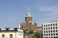 The Uspenski Orthodox Cathedral viewed through a modern buildings on sunny day
