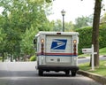USPS Delivery Truck on Suburban Street