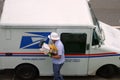 USPS Mailman with Mask and Gloves During the COVID-19 Coronavirus Pandemic