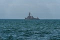 USS MC Faul DDG-74 warship moored at open sea.