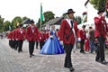 Usseln, Germany - July 29th, 2018 - Rifle club members parading in their traditional red uniforms at the marksmen`s fair with the Royalty Free Stock Photo