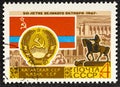 USSR - CIRCA 1967: post stamp printed in the USSR shows Coat of Arms, Flag and monument Kazakh SSR, serie 50 years of