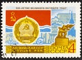USSR - CIRCA 1967: post stamp printed in the USSR shows Coat of Arms, Flag and monument Latvian SSR, serie 50 years of