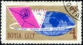Postage stamp with the image of Envelopes and Globe. From the series International Letter Writing Week, circa 1964 Royalty Free Stock Photo