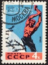 USSR - CIRCA 1963: Postage stamp printed in USSR Russia shows Worker Breaking Chains of Capitalism, Centenary of First
