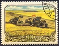 USSR - CIRCA 1956: A postage stamp printed in the USSR shows harvesting wheat in collective farm peasantry in Soviet