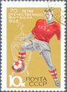 Postage stamp printed in USSR with a picture of a footballs players, with the inscription `70th anniversary of USSR football`