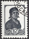 USSR - CIRCA 1953: USSR Soviet Union used postage stamp depicting a Female worker, 1953.