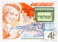 Stamp printed in USSR, shows mail processing woman postal official and automatic letter sorting machine