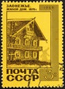 USSR - CIRCA 1968: A stamp printed in the USSR, shows old wooden house 1876 in northern russian village Zaonezhie.