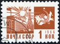USSR - CIRCA 1966: A stamp printed in USSR shows the Palace of Congresses, Kremlin and communism emblem with map, circa 1966.
