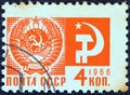 USSR - CIRCA 1966: A stamp printed in USSR shows the Coat of Arms and communism emblem, circa 1966. Royalty Free Stock Photo