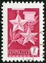 USSR - CIRCA 1976: A stamp printed in USSR shows Golden Star and Hammer and Sickle medals, circa 1976.