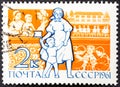 USSR - CIRCA 1961: A stamp printed in USSR shows teacher and child, children in kindergarten without inscription, from