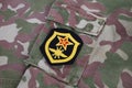 USSR military uniform - Soviet Army Signal Troops shoulder patch on camouflage uniform background