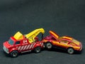 Toy cars - The tow truck pulling a car