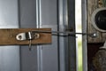 The usual lock on the door in the form of steel wire Royalty Free Stock Photo