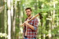 Usual work. man ready for splitting wood and cutting firewood with axe. prepare to chop down tree. chopping and