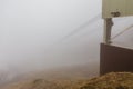 Usuzan Ropeway pole that cable disappear in the fog, view from Mount Usu in Hokkaido, Japan