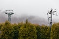 Usuzan Ropeway pole with trees and fog in winter in Hokkaido, Japan