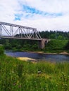 Usva river railway bridge and rainy forest