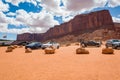 Car parked near famous red rocks of Monument Valley. Navajo Tribal Park landscape Royalty Free Stock Photo