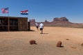 A group of tourists arriving at a viewpoint in the Monument Valley with the sandstone buttes on the background