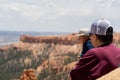 Two senior citizen adults man and woman enjoy the view at Bryce Canyon National Park
