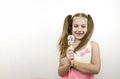 Ute toothless little girl with blue eyes hold the lollipop and smiling Royalty Free Stock Photo
